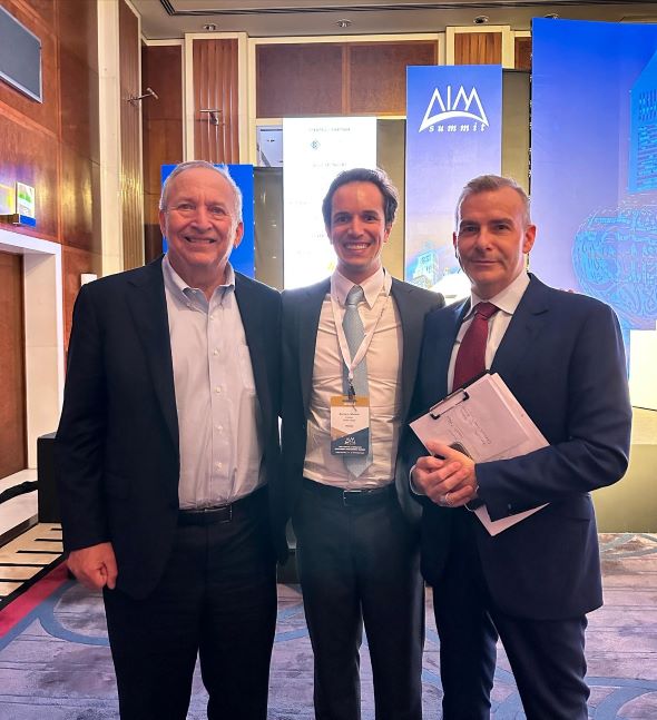  Zachary Cefaratti, Larry Summers and Manus Cranny at the AIM Summit, Dubai.